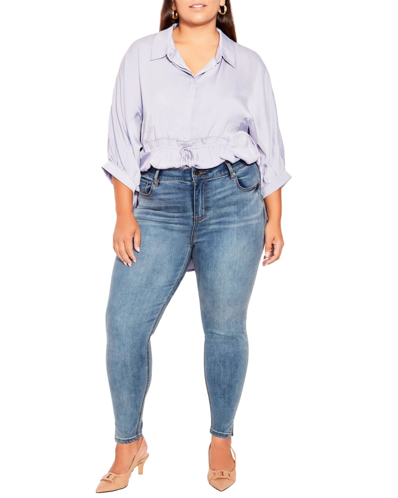 Plus size model wearing Visionary Split Hem Skinny Jean by Arna York | Dia&Co | dia_product_style_image_id:197422
